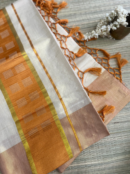Kanakambari – Balaramapuram Kasavu Saree with Copper Orange Kasavu Border
