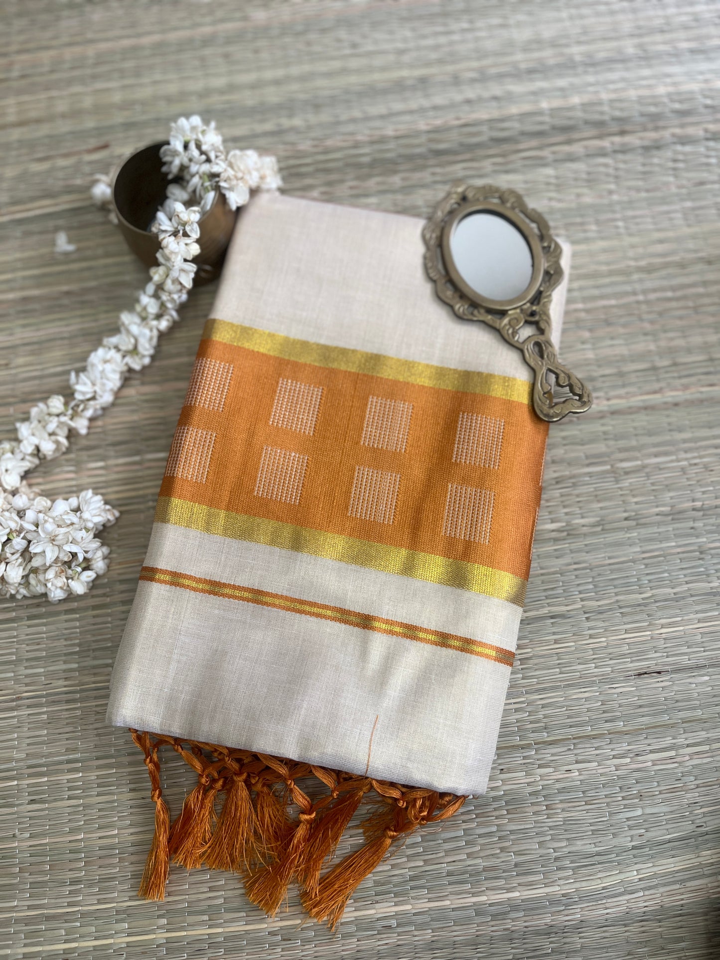 Kanakambari – Balaramapuram Kasavu Saree with Copper Orange Kasavu Border