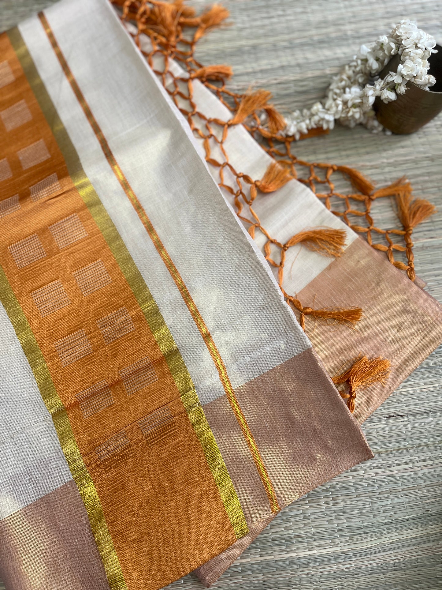 Kanakambari – Balaramapuram Kasavu Saree with Copper Orange Kasavu Border
