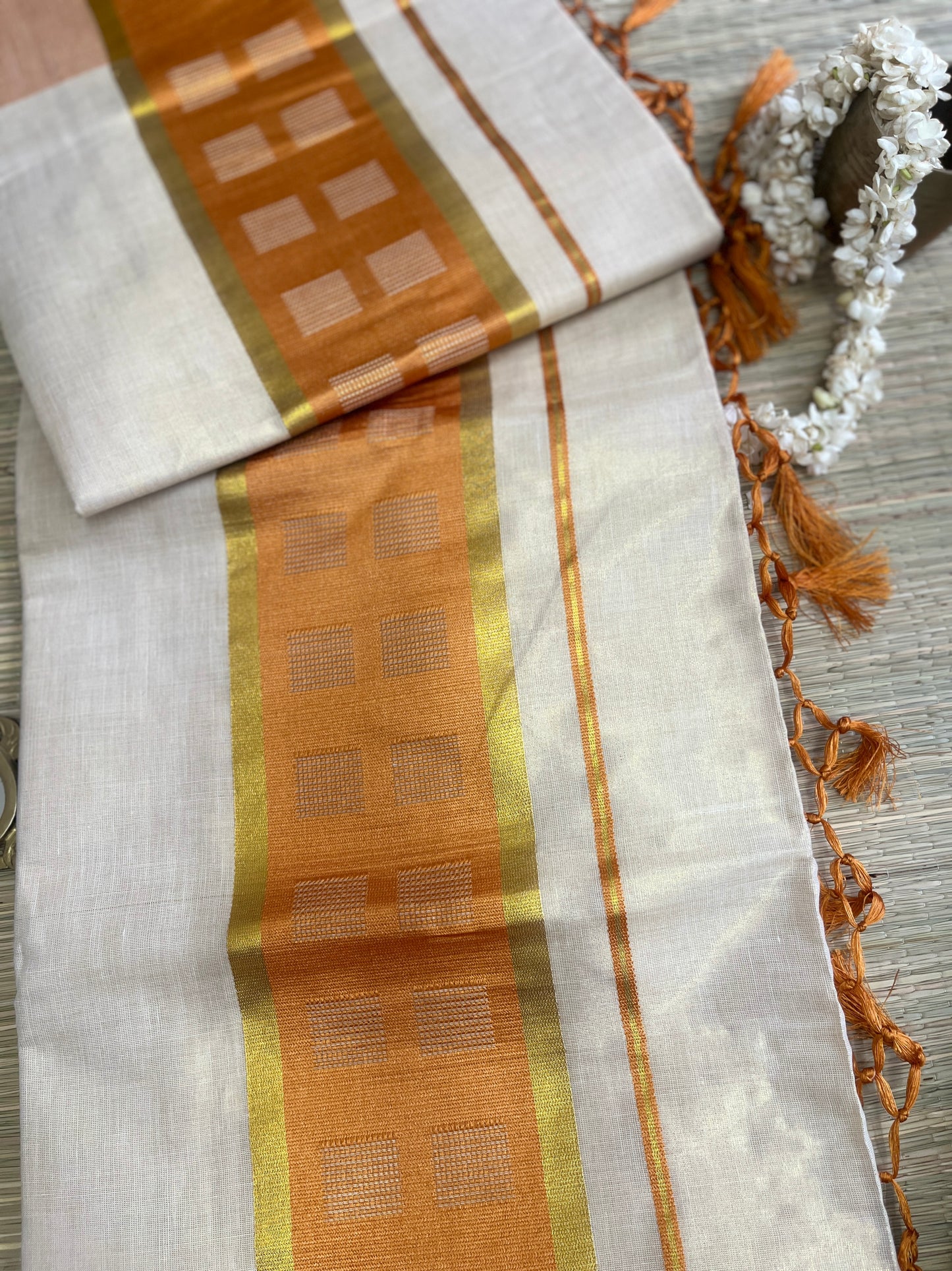 Kanakambari – Balaramapuram Kasavu Saree with Copper Orange Kasavu Border