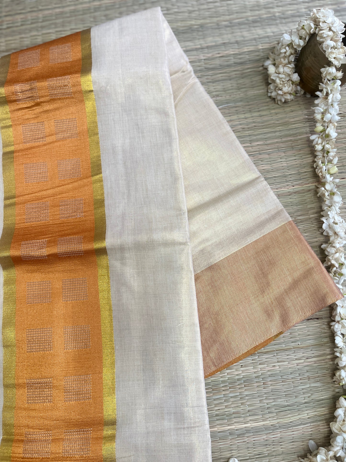 Kanakambari – Balaramapuram Kasavu Saree with Copper Orange Kasavu Border