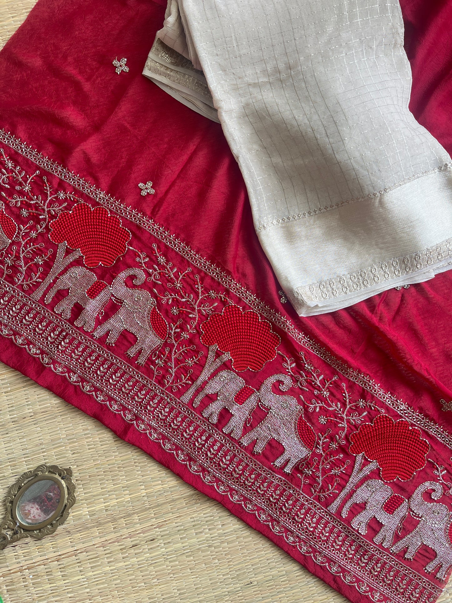 AINA-  Ivory Viscose Georgette Saree with Red Zari Handwork Blouse Piece